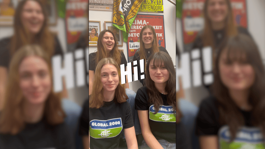 Video-Thumbnail, darauf sind vier junge Frauen abgebildet die in die Kamera lachen. Sie haben alle schwarze Shirts an, auf denen ein großes GLOBAL 2000 Logo abgebildet ist. In der Mitte ist der Schriftzug "Hi!"